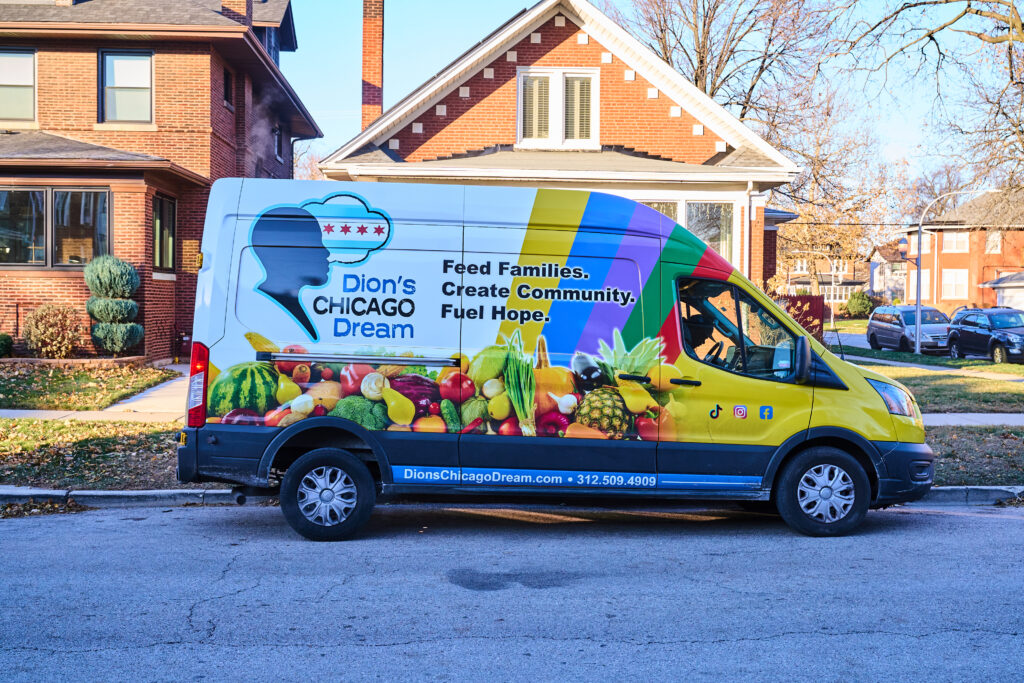 Image of a colorful distribution van for Dion's Chicago Dream parked in front of a house.